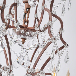 Moorizon Rustline 25-light crystal chandelier with antique iron arms, candle sleeves, and hanging crystal accents, white background detail view