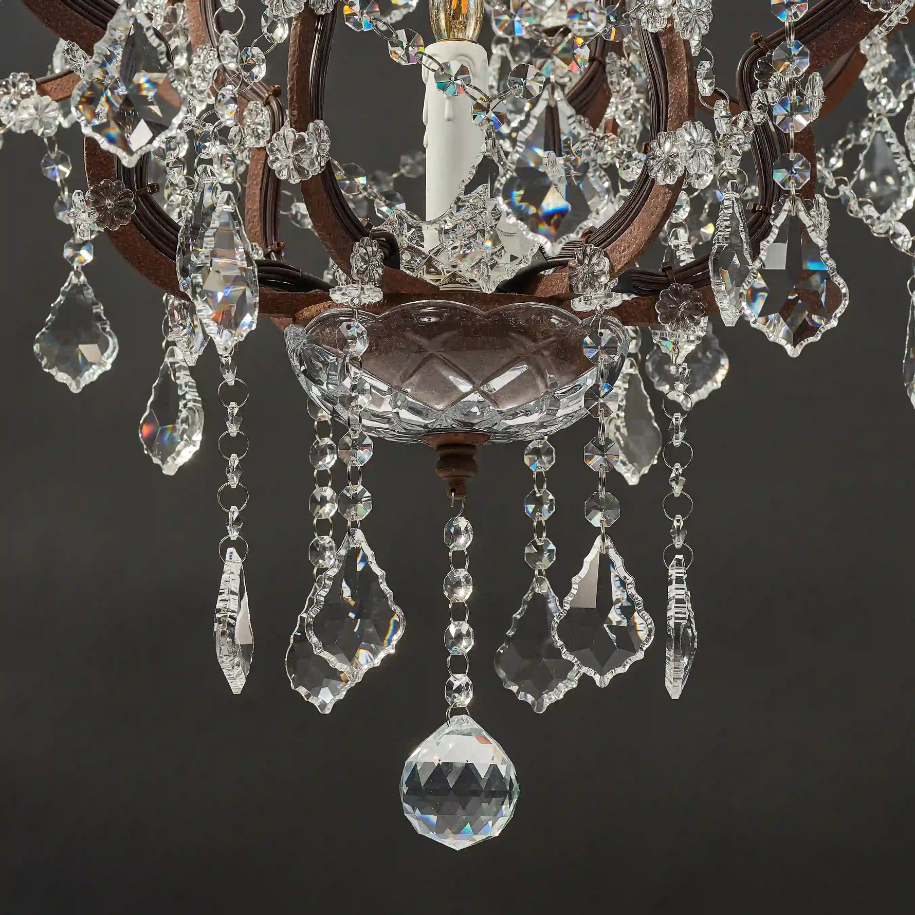 Moorizon Rustline 25-light crystal chandelier with candle-style bulbs, ornate iron frame, and hanging crystals, black background detail view