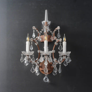 Unlit Moorizon Rustline 3-light wall sconce with ornate iron frame, candle sleeves, and cascading crystal drops on a dark background
