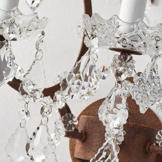 Unlit Moorizon Rustline 3-light wall sconce detail showing faceted crystal drops, decorative chains, and antique-style metal accents