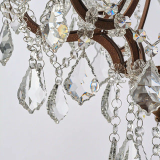 Moorizon Rustline 6-light crystal chandelier close-up with faceted crystal drops and metal frame details, white background detail view, unlit