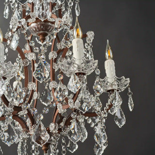 Moorizon Rustline 6-light crystal chandelier with layered crystals and candle-style bulbs, black background detail view, unlit