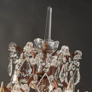 Rustline crystal floor lamp detail with faceted crystal pendants and rusted metal accents in black background. 