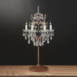 Unlit Moorizon Rustline crystal table lamp with chandelier-inspired crystal shade, candle sleeves, and a slender base on a black background