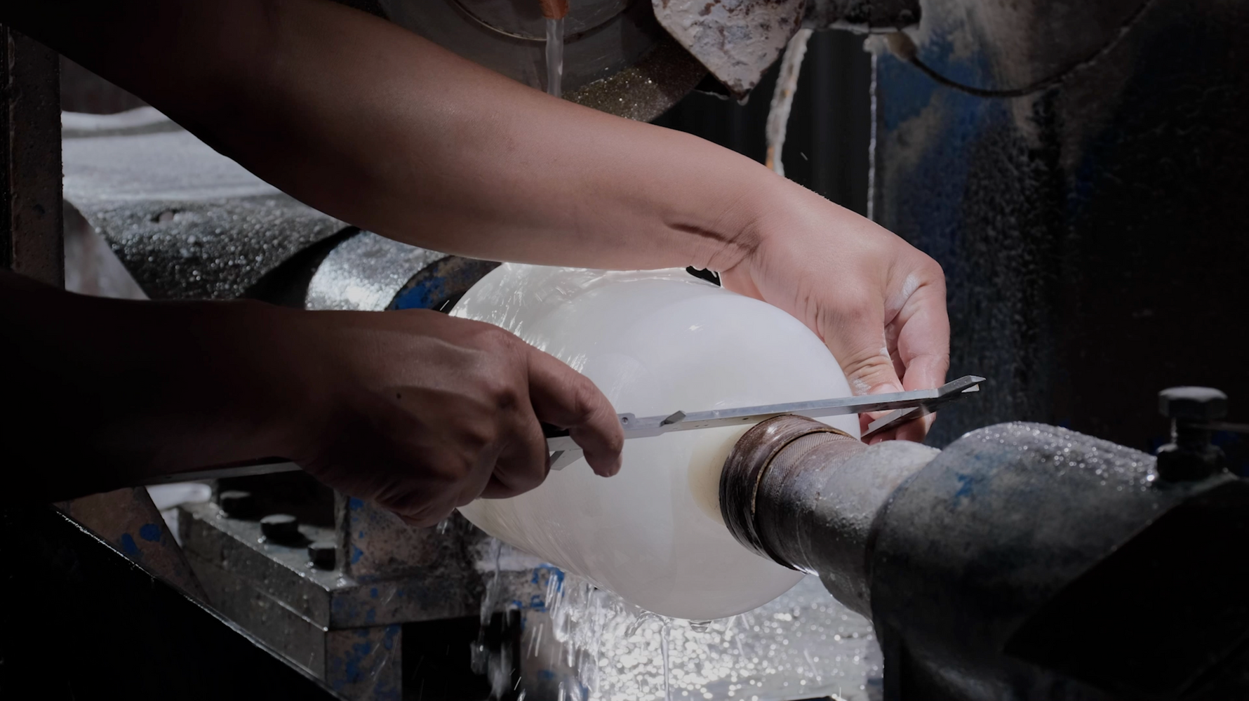 Stone lamp craftsmanship — shaping and detailing process close-up