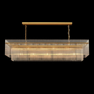 Lit front view of the 72-inch Timelore Rectangular Chandelier with individual clear glass rods suspended from a warm brass frame.