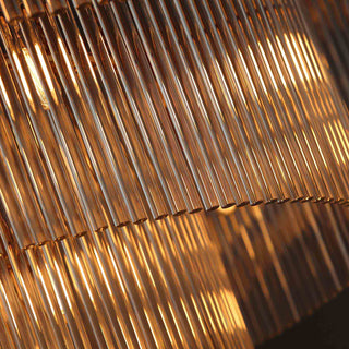 close-up of timelore chandelier showcasing finely textured crystal rods and brushed brass frame