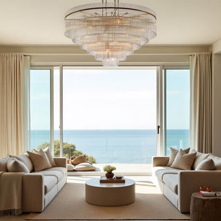 timelore tiered round chandelier with solid crystal rods and natural brass frame styled in a modern villa living room interior