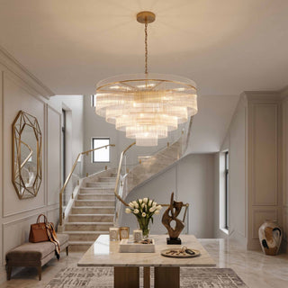 Timelore medium round chandelier with clear glass rods in a bright luxury entryway.