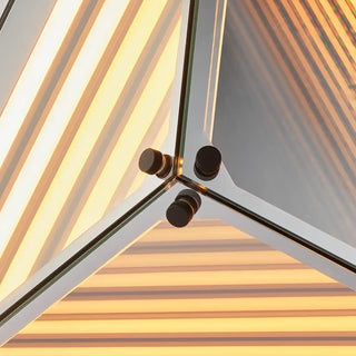 Warmly lit Moorizon Trigon LED infinity glass mirror detail with layered amber LED lines, reflective glass panels, and corner hardware