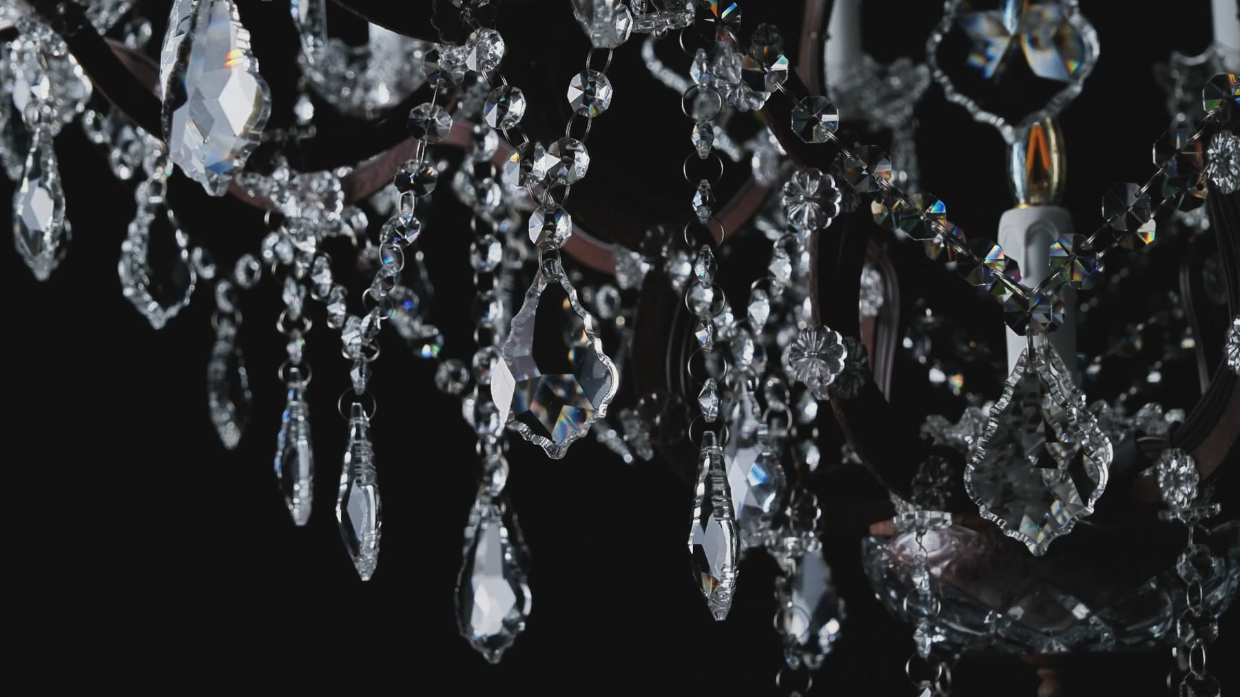 Rustline crystal lighting collection video showcasing precision-cut K9 crystals, candle-style lights, and an oxidized iron frame.