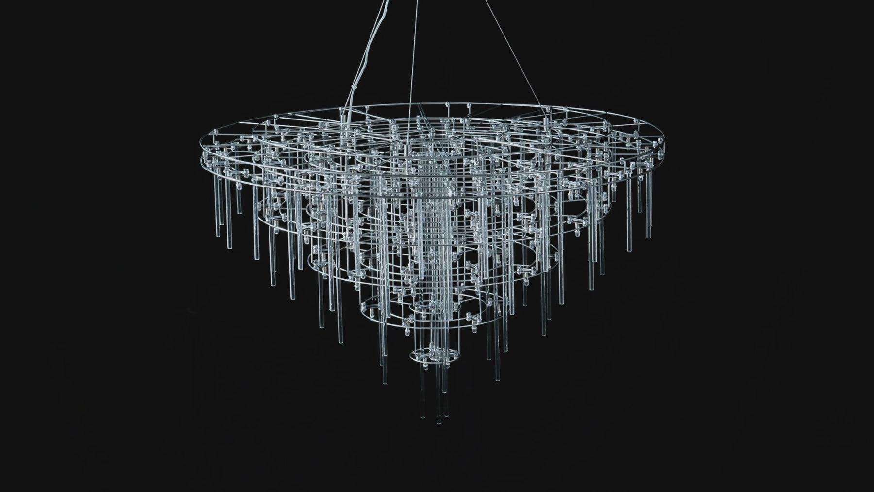 Aura Round Tiered Glass Rod Chandelier shown illuminated and unlit in full and close-up views, highlighting cascading tiers of clear glass rods and warm points of light.