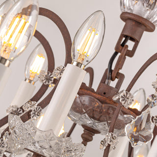 close up detail of rustline chandelier arm and crystal embellishments in staircase setting