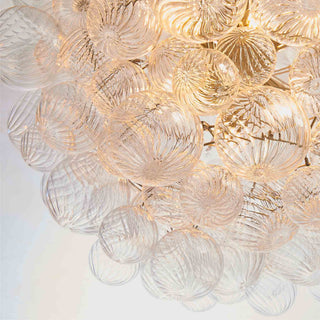 detail view of lumious hand-blown spiral glass globes wih ripple pattern in art deco modern design