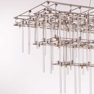 close-up detail of stardust chandelier focusing on warm lighting, glass rod texture and polished metal reflections