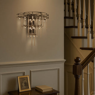 Large Stardust Sconce Lamp installed in a stairwell setting, casting elegant shadows on the wall and emphasizing vertical space