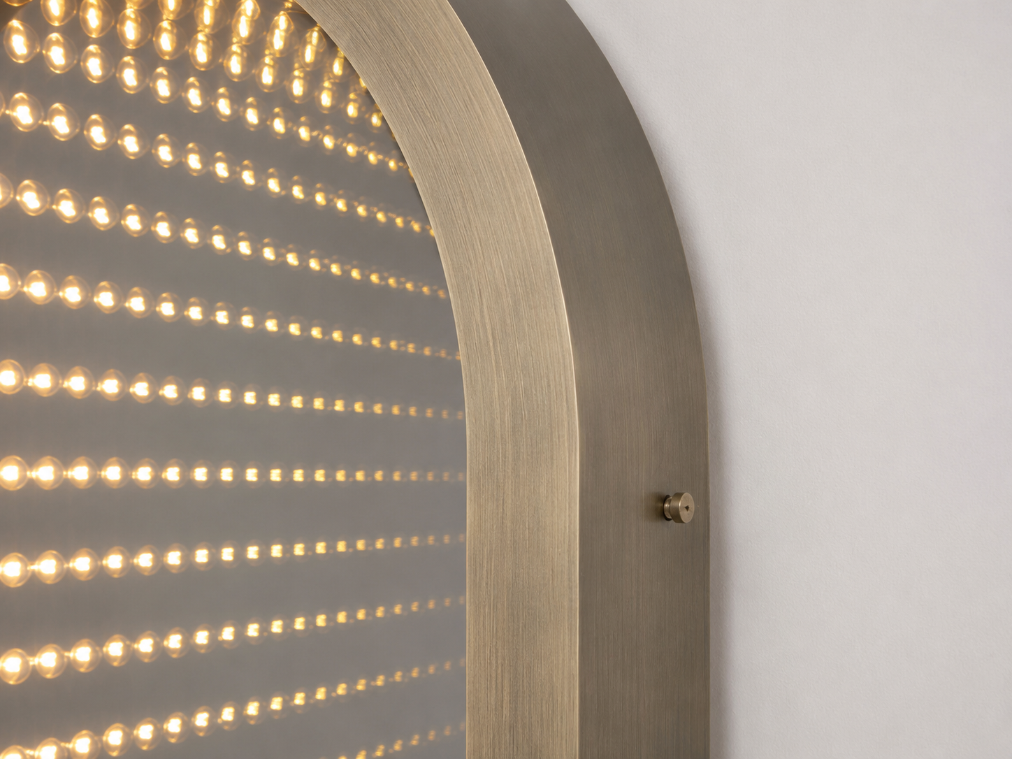 Side profile of the Timeless Gate arched LED mirror showing its frame depth