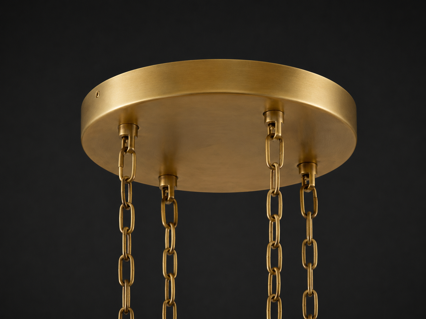 Close-up of the Timelore chandelier round brass ceiling canopy with decorative suspension chains