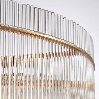 close-up of timelore chandelier showcasing finely textured crystal rods and brushed brass frame