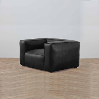 angle view Titan Luxe 1-Seater Sofa in  Matte Black Full-Grain Leather – Modern Luxury Armchair on Wooden Floor