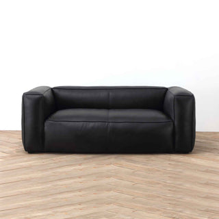 Titan Luxe 2-Seater Sofa in Black Full-Grain Leather on wooden floor – Contemporary Living Room Sofa