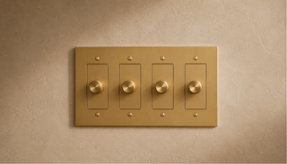 Wall dimmer controls for adjusting chandelier brightness from low ambient light to full illumination.