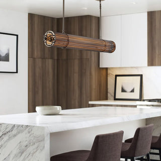 Urban Glow pendant styled over a minimalist kitchen island with wood-accented interiors