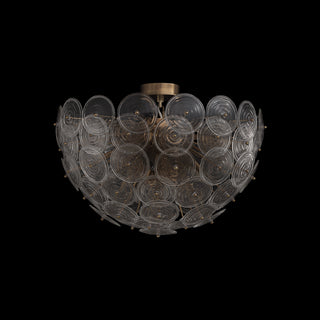 Side view of Wavora demi flushmount on black background, warm light shining through layered glass petals